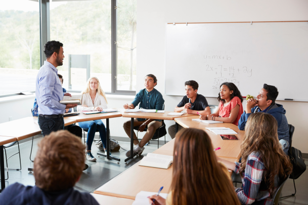 Facilitator leading a group of students